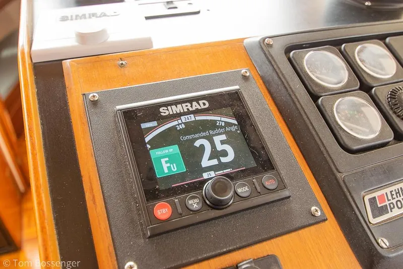 Slide: The Image of Simrad control panel on 1986 Ponderosa 47 boat dashboard, displaying rudder angle. - 73