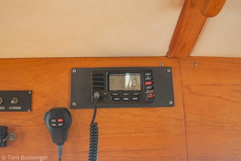Slide: The Image of VHF radio and microphone on a 1986 Ponderosa 47 boat dashboard. - 76