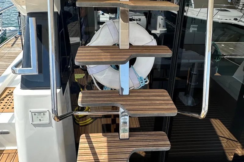 Slide: The Image of Staircase on 2017 Bavaria Virtess 420 Fly yacht with wooden steps and metal railing. - 10