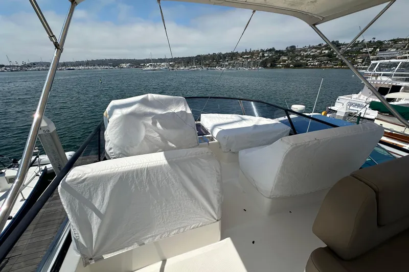 Slide: The Image of Flybridge view of 2017 Bavaria Virtess 420 Fly yacht docked at marina. - 11