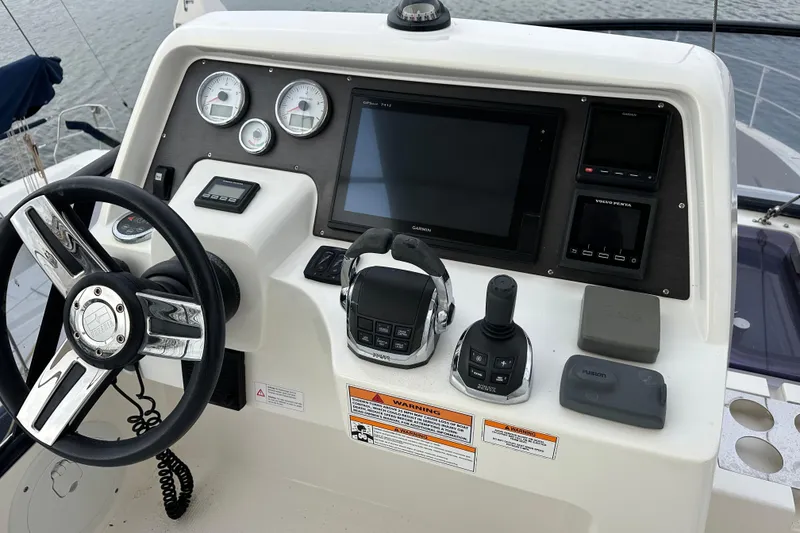 Slide: The Image of Control panel of 2017 Bavaria Virtess 420 Fly yacht with steering wheel and navigation instruments. - 17