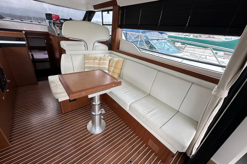 Slide: The Image of Luxurious interior of 2017 Bavaria Virtess 420 Fly yacht with white seating and wooden accents. - 18