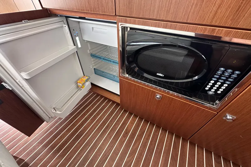 Slide: The Image of Galley of 2017 Bavaria Virtess 420 Fly with open fridge and microwave. - 22