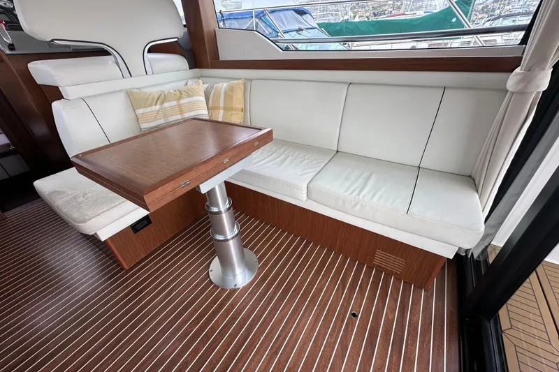 Slide: The Image of Luxurious interior of 2017 Bavaria Virtess 420 Fly yacht with white seating and wooden table. - 23