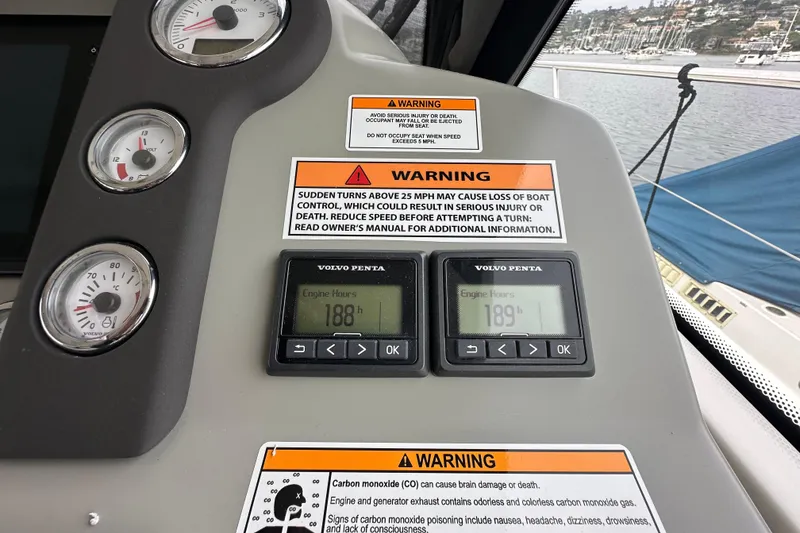 Slide: The Image of Control panel of 2017 Bavaria Virtess 420 Fly with engine hours and warning labels. - 24