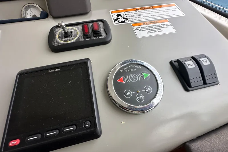 Slide: The Image of Control panel of 2017 Bavaria Virtess 420 Fly yacht with Garmin display and thruster controls. - 27