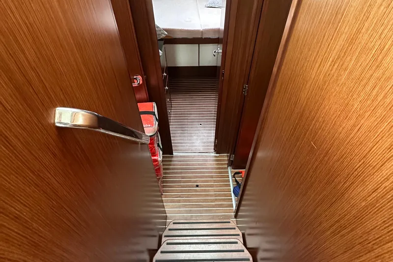 Slide: The Image of Interior view of 2017 Bavaria Virtess 420 Fly yacht, featuring wooden flooring and cabin access. - 31