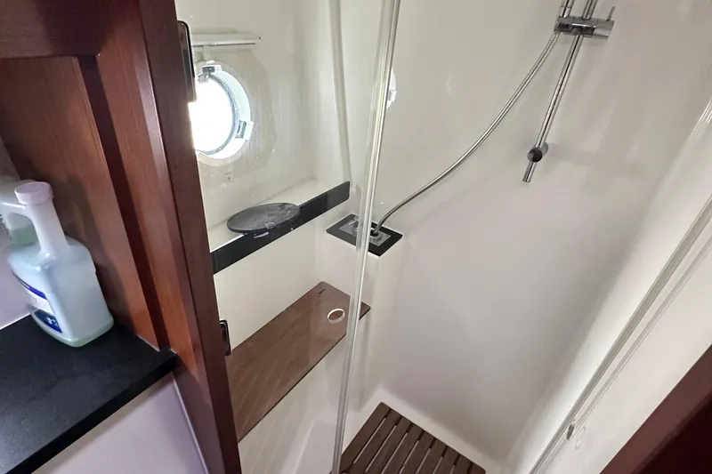 Slide: The Image of Shower area in 2017 Bavaria Virtess 420 Fly yacht with modern fixtures and porthole. - 33
