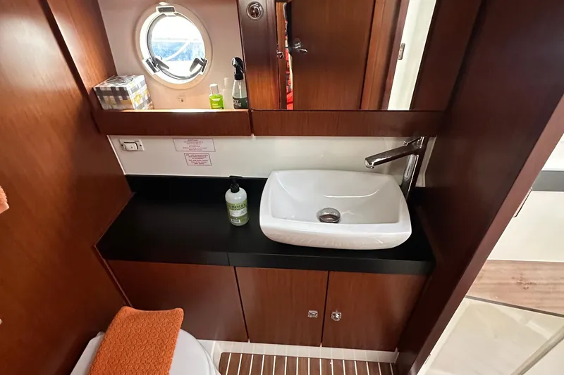 Slide: The Image of Luxurious bathroom interior of 2017 Bavaria Virtess 420 Fly yacht with modern sink and porthole. - 36