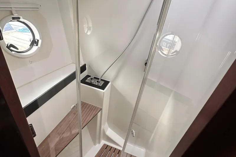 Slide: The Image of 2017 Bavaria Virtess 420 Fly yacht bathroom with shower and porthole windows. - 37