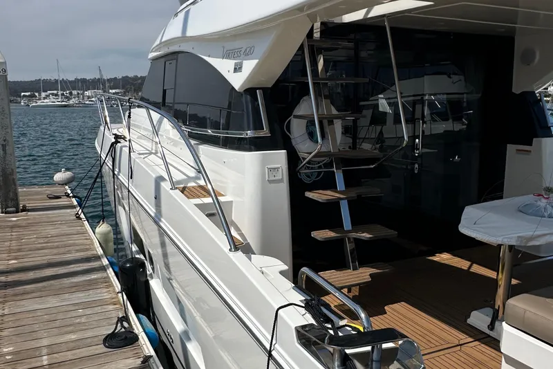 Slide: The Image of 2017 Bavaria Virtess 420 Fly yacht docked at marina, showcasing sleek design and spacious deck. - 4