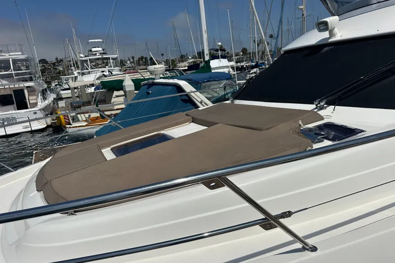 Slide: The Image of 2017 Bavaria Virtess 420 Fly yacht docked in a marina, featuring a sunpad on the deck. - 5