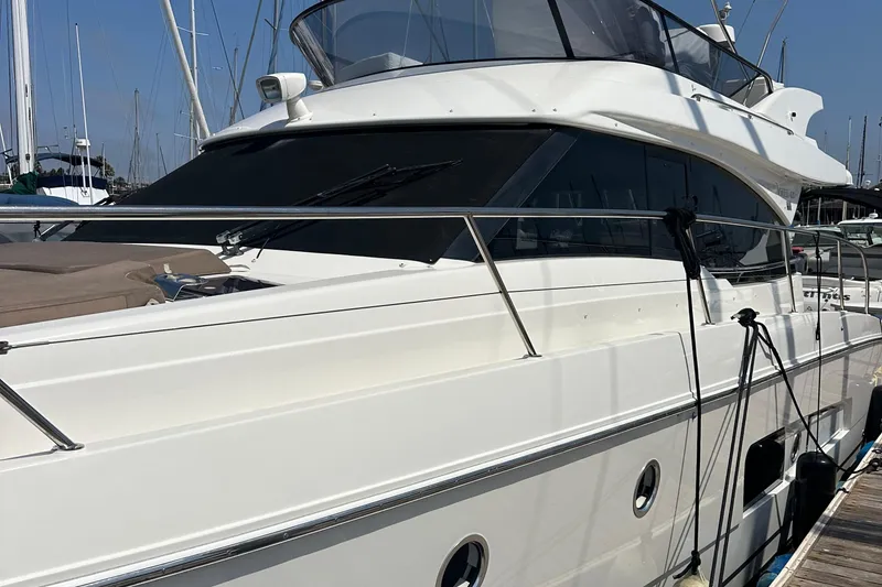 Slide: The Image of 2017 Bavaria Virtess 420 Fly yacht docked at marina, showcasing sleek design and modern features. - 6