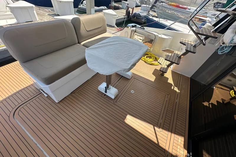 Slide: The Image of 2017 Bavaria Virtess 420 Fly yacht deck with seating and covered table. - 9