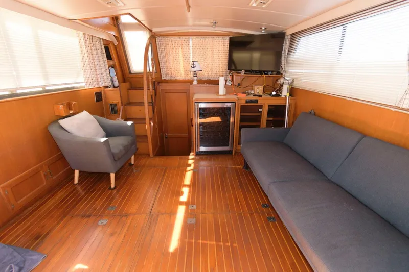 Slide: The Image of Interior of 1988 Symbol 55 Cockpit Motor Yacht with wooden flooring and modern furnishings. - 12