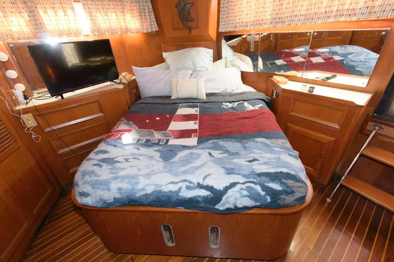 Slide: The Image of Cozy bedroom in 1988 Symbol 55 Cockpit Motor Yacht with TV and nautical decor. - 20