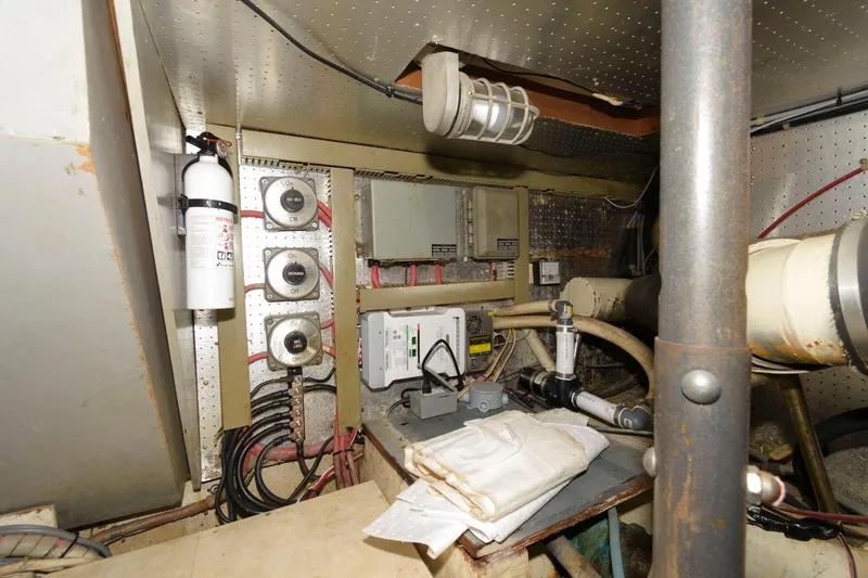Slide: The Image of Engine room of 1988 Symbol 55 Cockpit Motor Yacht with equipment and wiring. - 29