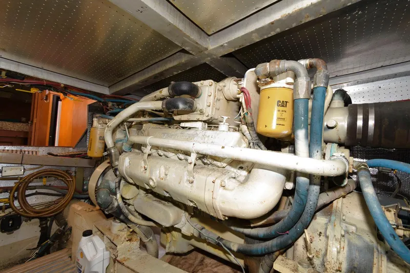 Slide: The Image of Engine room of a 1988 Symbol 55 Cockpit Motor Yacht with visible CAT components. - 30