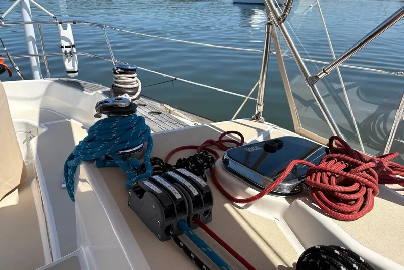 Slide: The Image of Tartan 4100 sailboat deck with ropes and winches, 2005 model, on calm water. - 25