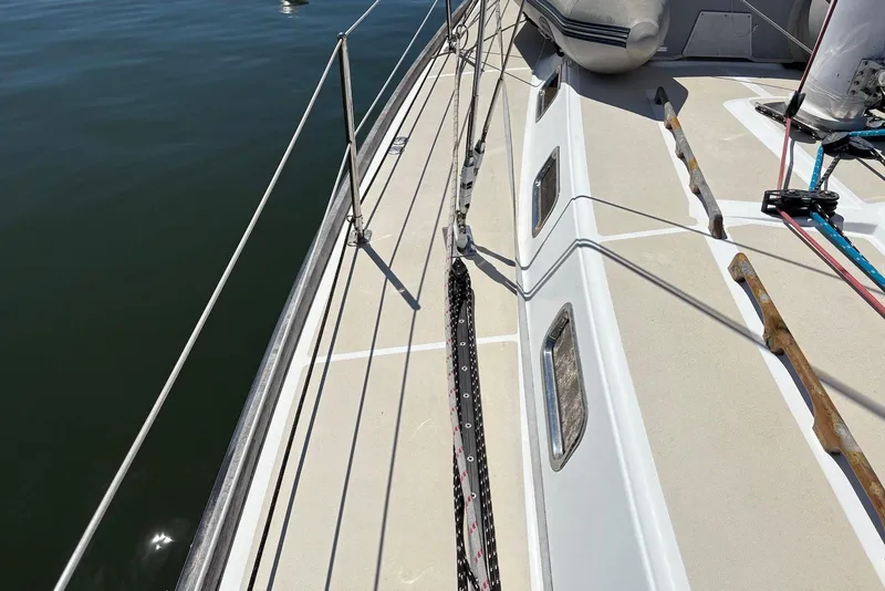 Slide: The Image of Deck view of a 2005 Tartan 4100 sailboat with railing and rigging. - 31