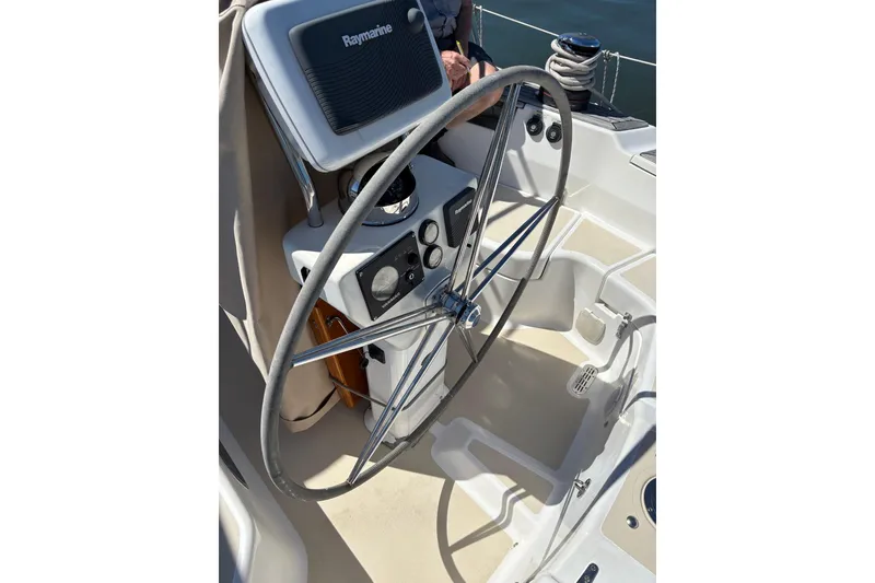 Slide: The Image of Steering wheel of a 2005 Tartan 4100 sailboat with Raymarine equipment. - 40