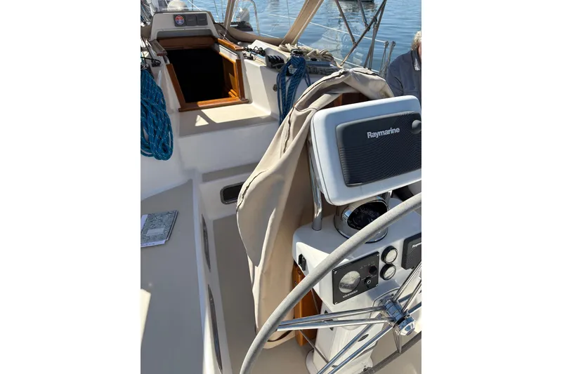Slide: The Image of Cockpit of 2005 Tartan 4100 sailboat with Raymarine navigation equipment. - 41