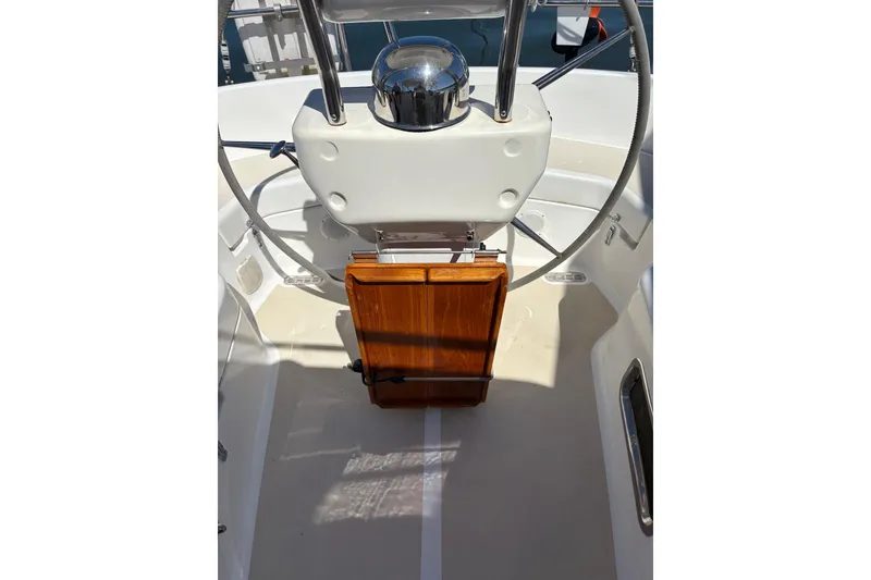 Slide: The Image of 2005 Tartan 4100 yacht cockpit with steering wheel and wooden panel. - 42