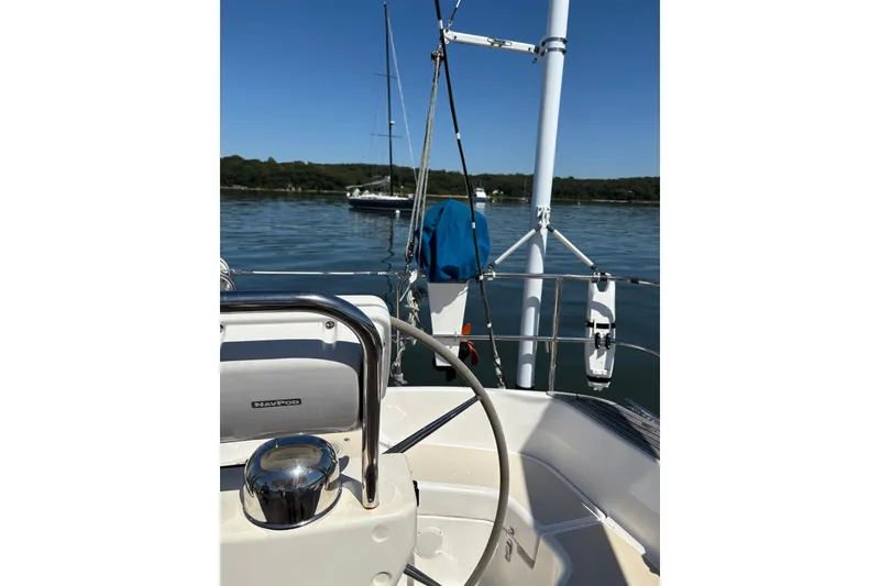 Slide: The Image of Sailboat cockpit view, Tartan 4100, 2005 model, on calm water with clear blue sky. - 43
