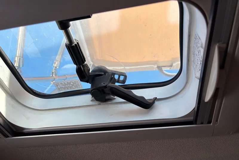Slide: The Image of Boat hatch window mechanism on a 2005 Tartan 4100 sailboat, featuring a Bomar brand label. - 47