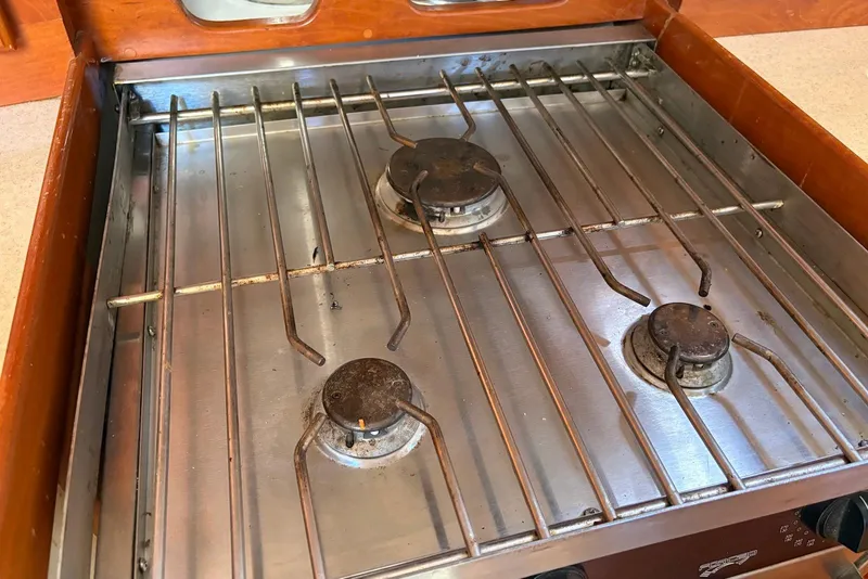 Slide: The Image of Three-burner stainless steel stove on a 2005 Tartan 4100 yacht. - 48