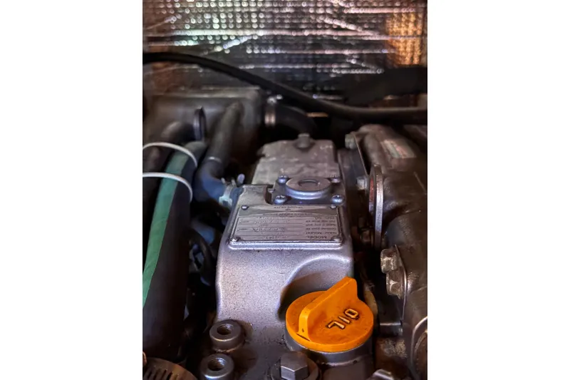 Slide: The Image of Engine compartment of a 2005 Tartan 4100 with visible oil cap. - 56