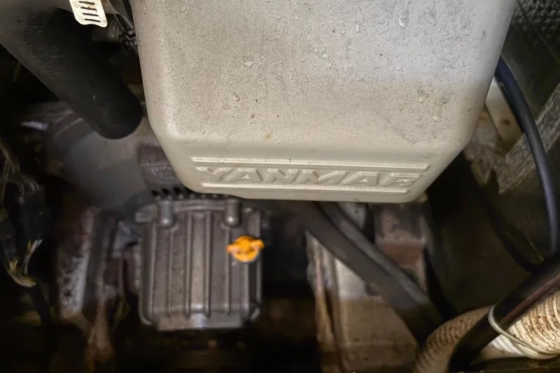Slide: The Image of Engine compartment of a 2005 Tartan 4100 with Yanmar components visible. - 59