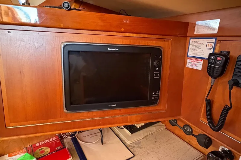 Slide: The Image of Navigation equipment on a 2005 Tartan 4100 sailboat, featuring Raymarine electronics. - 6