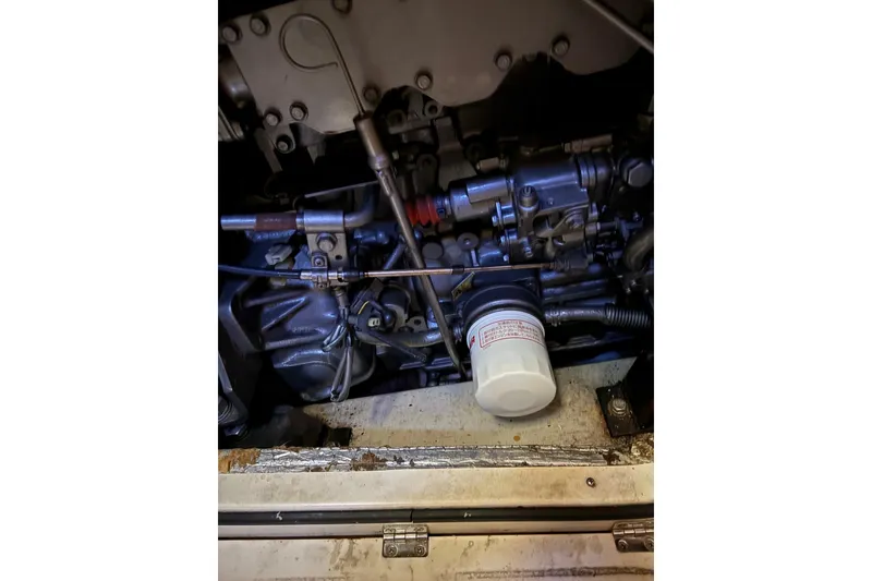 Slide: The Image of Engine compartment of a 2005 Tartan 4100, showcasing mechanical components and filter. - 60