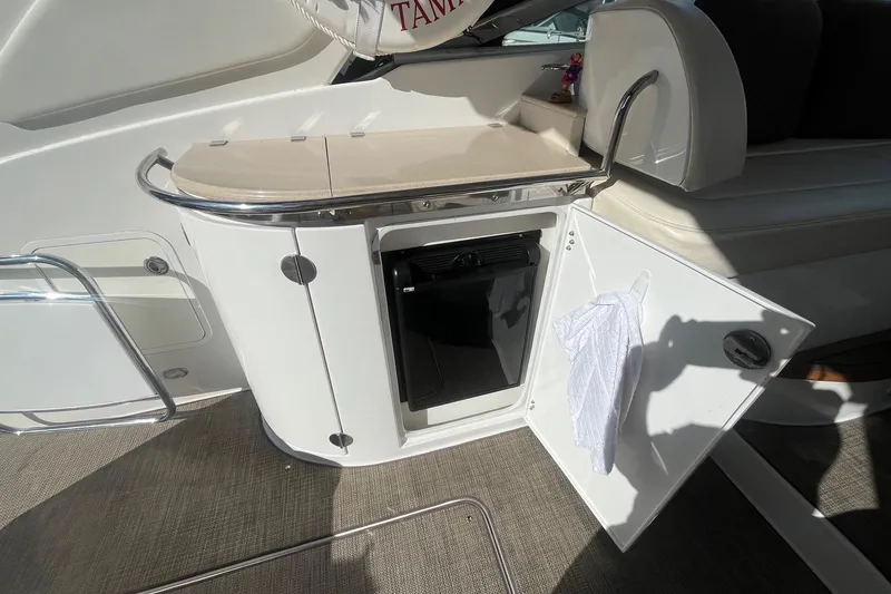 Slide: The Image of 2009 Cobalt 373 yacht interior with open cabinet and towel. - 15