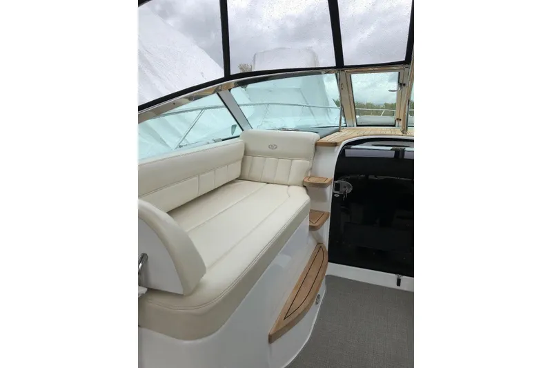 Slide: The Image of Interior of 2009 Cobalt 373 boat with cream seating and wooden accents. - 18