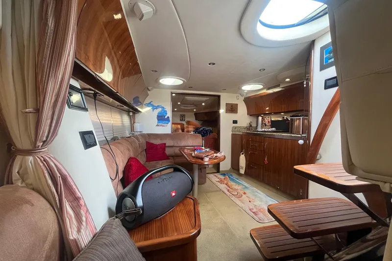 Slide: The Image of Luxurious interior of a 2009 Cobalt 373 yacht with elegant wood finishes and cozy seating. - 24