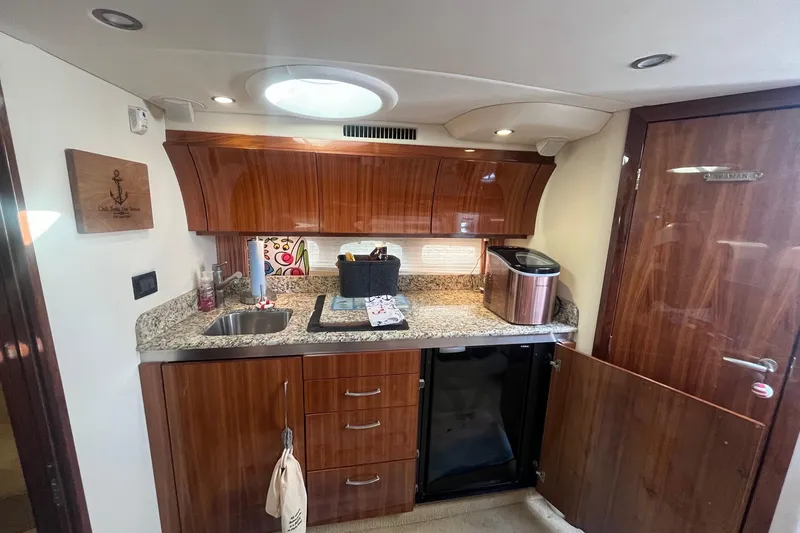 Slide: The Image of Luxurious 2009 Cobalt 373 yacht interior with elegant wood cabinetry and granite countertops. - 27