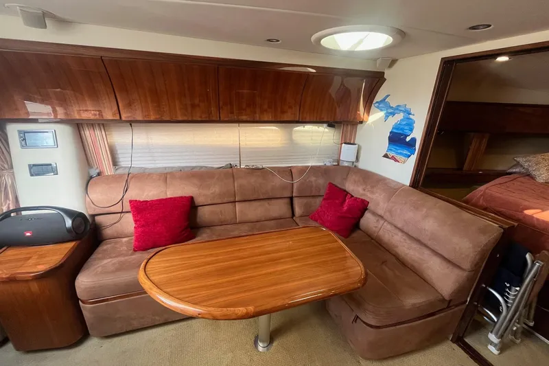 Slide: The Image of Luxurious 2009 Cobalt 373 yacht interior with plush seating and wooden table. - 28