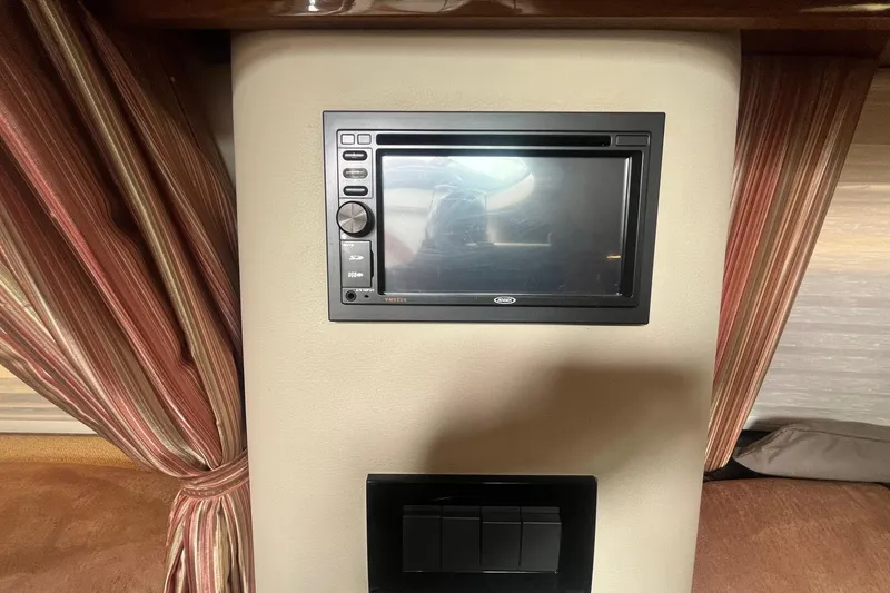 Slide: The Image of 2009 Cobalt 373 interior with built-in control panel and striped curtains. - 36