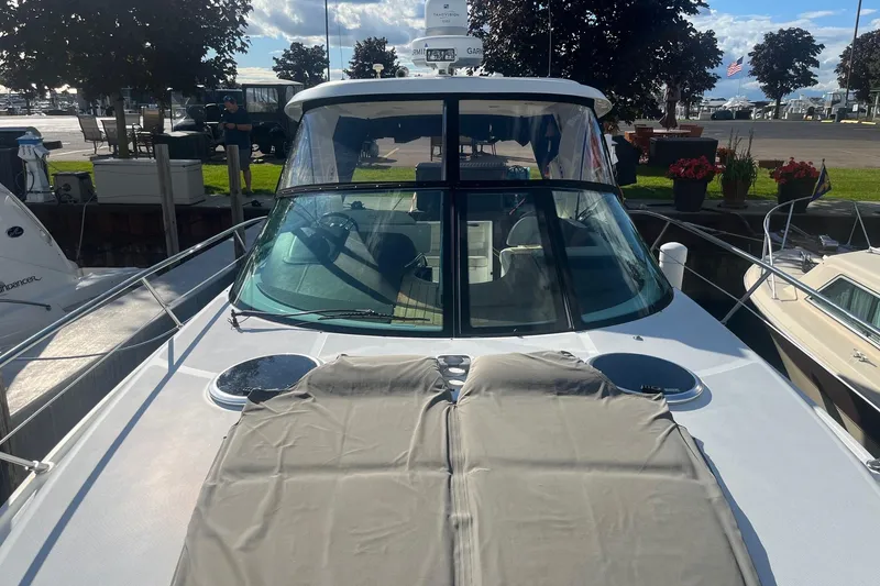 Slide: The Image of 2009 Cobalt 373 boat docked, featuring sleek design and spacious deck area. - 6