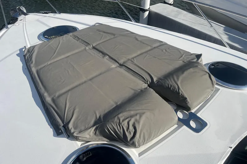 Slide: The Image of Cobalt 373 boat deck with cushioned sunpad, 2009 model, on calm water. - 7