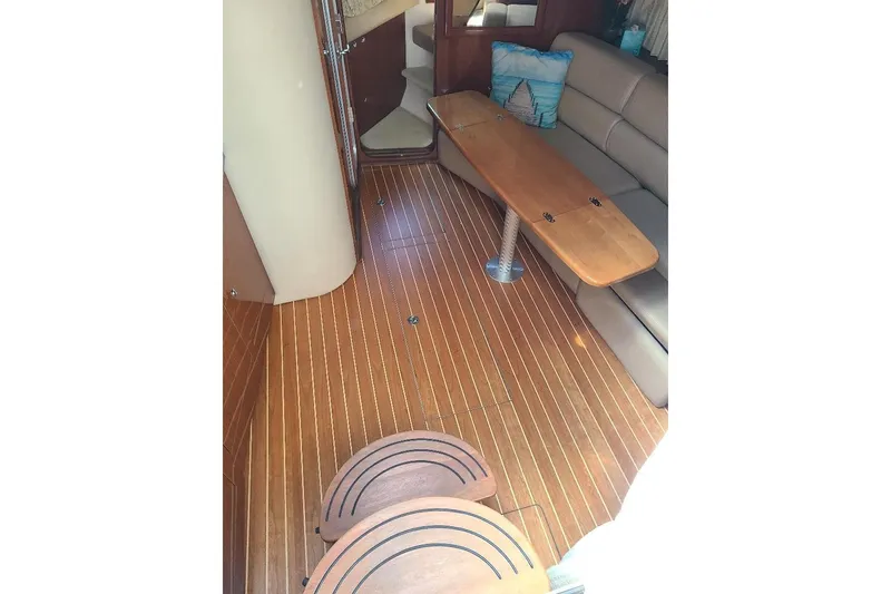 Slide: The Image of 2009 Regal Commodore 3760 IB interior with wooden flooring and cozy seating area. - 14