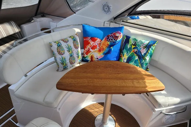 Slide: The Image of Luxurious 2009 Regal Commodore 3760 IB yacht interior with vibrant tropical-themed cushions. - 9