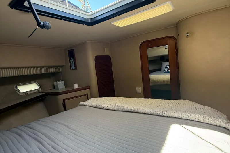 Slide: The Image of Interior cabin of 1987 Chris-Craft 392 Commander yacht with bed and skylight. - 14
