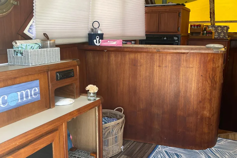 Slide: The Image of Interior of 1987 Chris-Craft 392 Commander with wooden cabinetry and nautical decor. - 20