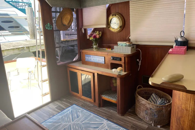 Slide: The Image of Interior of 1987 Chris-Craft 392 Commander yacht with wooden decor and nautical accents. - 22