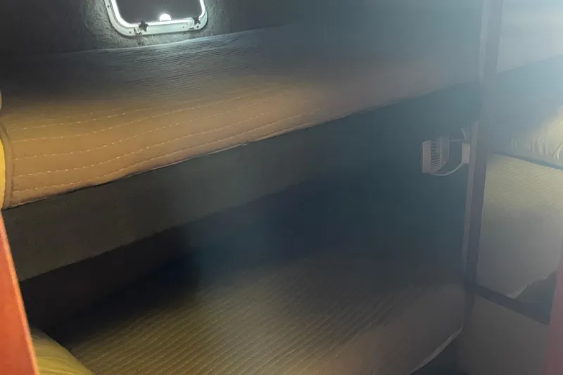 Slide: The Image of Interior cabin of 1987 Chris-Craft 392 Commander with bunk beds and porthole. - 25