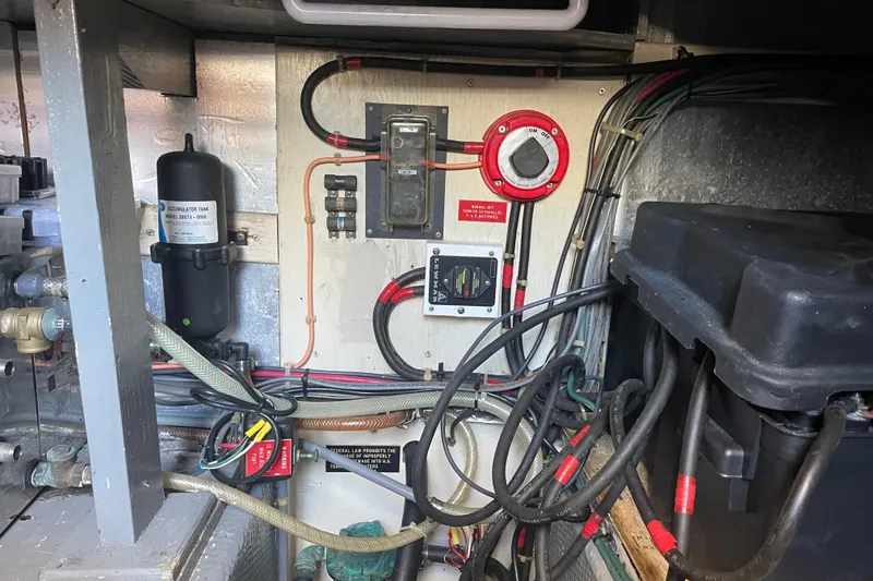 Slide: The Image of Electrical panel and wiring inside a 1987 Chris-Craft 392 Commander boat. - 26