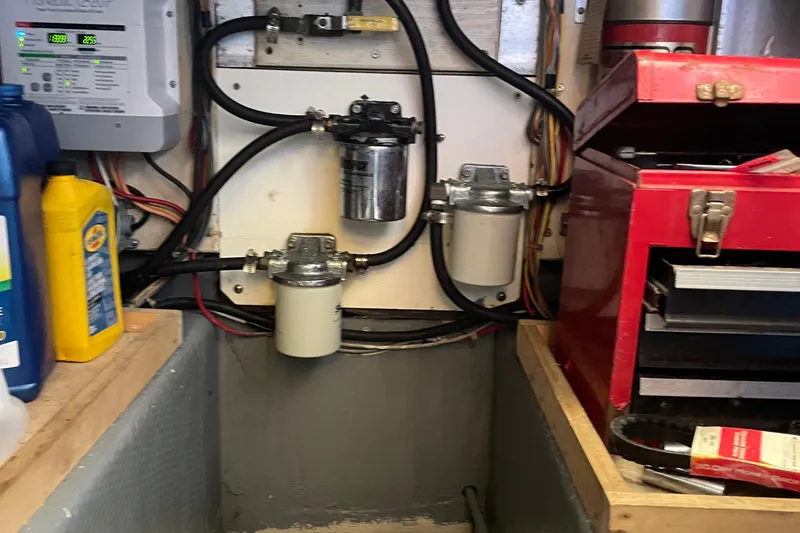 Slide: The Image of Engine room of 1987 Chris-Craft 392 Commander with filters and toolbox. - 29